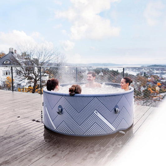 Family in a trendy portable hot tub spa pool on a rooftop with a scenic view of houses and trees - portablespasnz